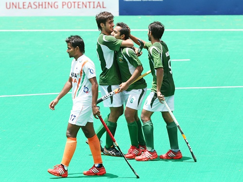Pakistan hockey players celebrate a goal