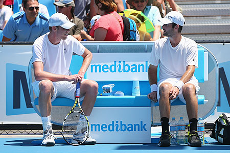 Sam Querrey of the of the US talks to compatriot Brian Baker after the latter retired from the second round match on Wednesday