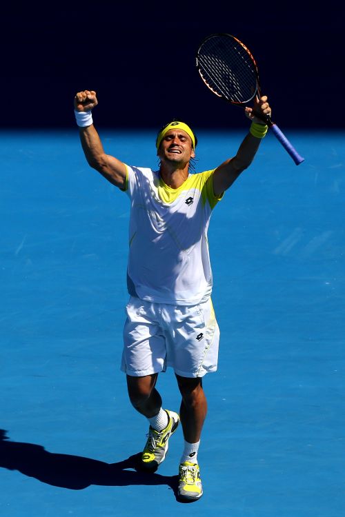 David Ferrer celebrates winning his fourth round match against Kei Nishikori of Japan during day seven of the 2013 Australian Open at Melbourne Park