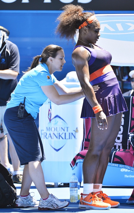 Serena Williams of the US receives treatment