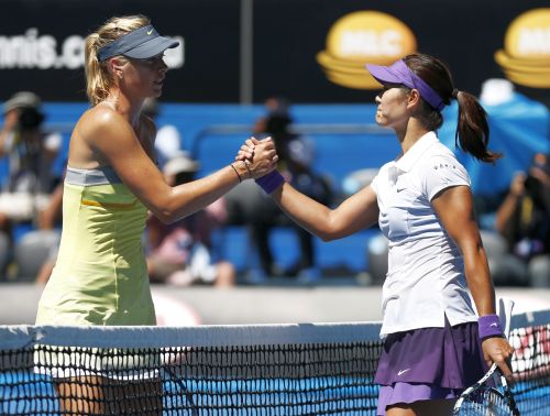 Li Na of China (R) shakes hands with Maria Sharapova of Russia after defeating her in their women's singles semi-final match