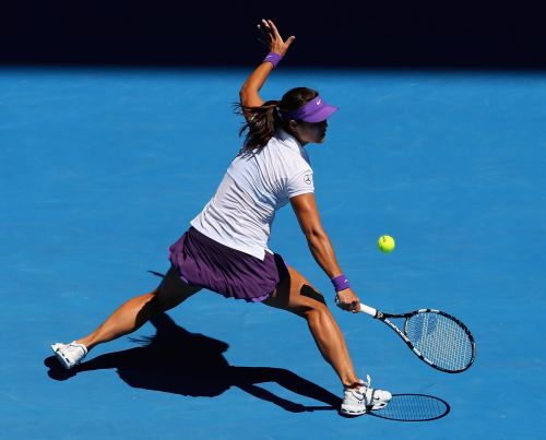 Na Li of China plays a backhand in her Semifinal match against Maria Sharapova of Russia