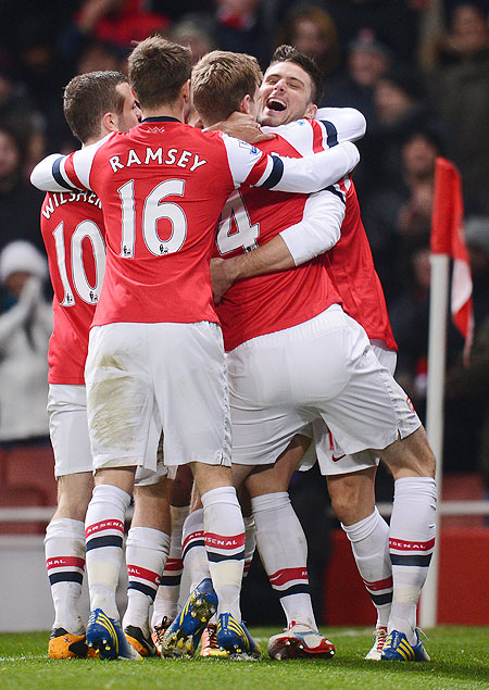 Arsenal's Olivier Giroud celebrates with teammates after scoring against West Ham United at Emirates Stadium on Wednesday