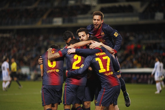 Barcelona's Pedro Rodriguez (centre) is congratulated by his teammates