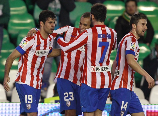 Atletico Madrid's Diego Costa (left) is congratulated by teammates