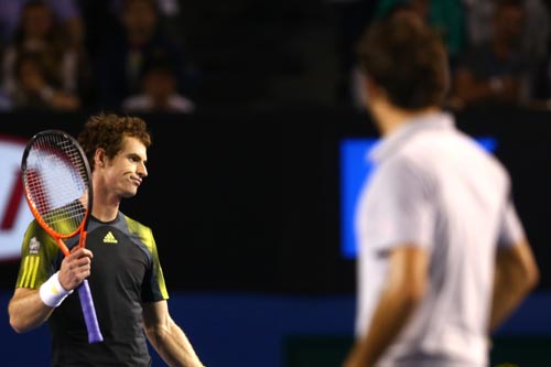 Andy Murray of Great Britain questions a line call in his semifinal match against Roger Federer of Switzerland