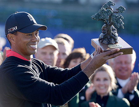 Tiger Woods with the trophy after winning the PGA Tour title at Torrey Pines in California on Monday