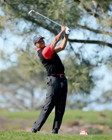 Tiger Woods hits off the 8th tee during the Final Round at the Farmers Insurance Open at Torrey Pines Golf Course on Sunday