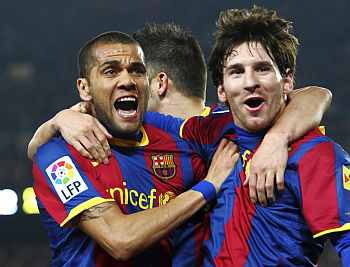 Barca's Lionel Messi with Dani Alves