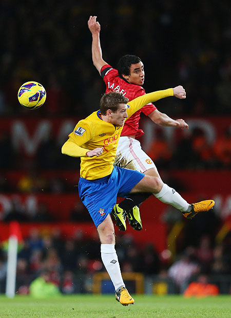 Rafael da Silva of Manchester United and Steven Davis of Southampton are involved in an aerial duel during their match on Wednesday