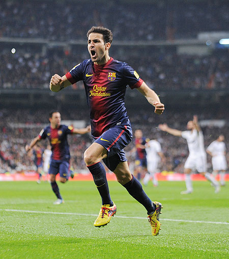 Barcelona'S Cesc Fabregas celebrates after scoring the opening goal against Real Madrid on Wednesday