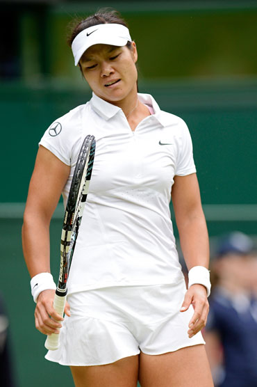 Na Li of China reacts during her quarter-final against Agnieszka Radwanska of Poland