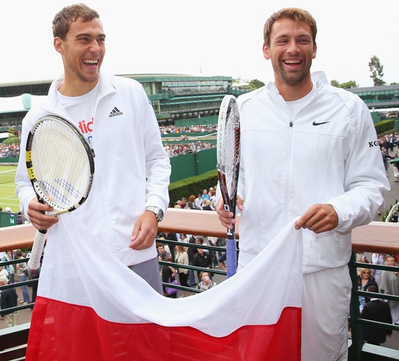 Jerzy Janowicz and Lukasz Kubot of Poland pose together as a preview to Thursday's quarter final match
