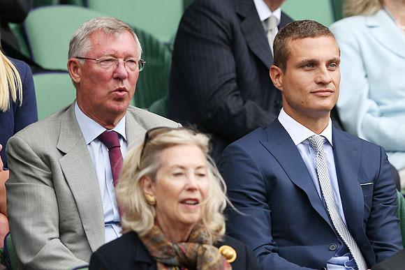  Sir Alex Ferguson and Nemanja Vidic watch the Wimbledon men's singles quarter-final between Andy Murray and Fernando Verdasco at the All England Lawn Tennis and Croquet Club at Wimbledon in July 2013