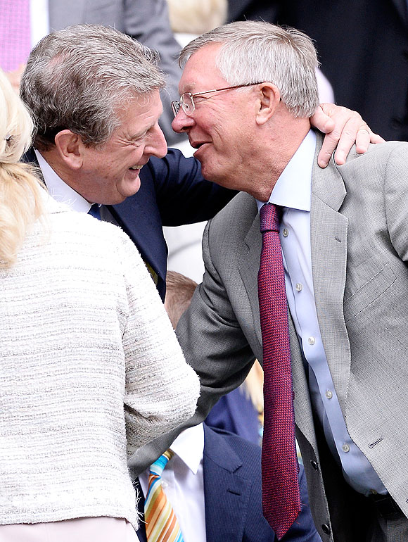 Roy Hodgson greets Sir Alex Ferguson in the Royal Box on centre court before the men's singles quarter-final between David Ferrer of Spain and Juan Martin Del Potro of Argentina at the All England Lawn Tennis and Croquet Club at Wimbledon on Wednesday