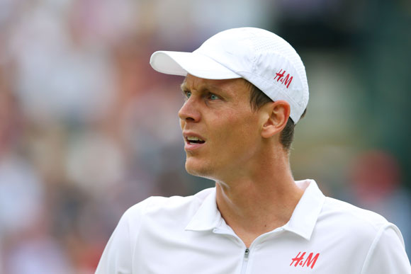 Tomas Berdych of Czech Republic reacts in his match against Djokovic