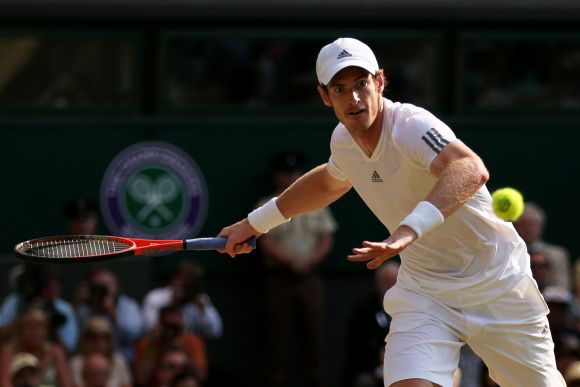 Andy Murray of Great Britain plays a forehand during the Gentlemen's Singles Final match against Novak Djokovic of Serbia on day thirteen of the Wimbledon Lawn Tennis Championships at the All England Lawn Tennis and Croquet Club