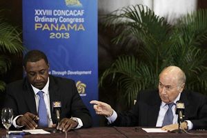 FIFA president Joseph Blatter (R) gestures to CONCACAF president Jeffrey Webb during a news conference at the CONCACAF congress in Panama City April 19, 2013.
