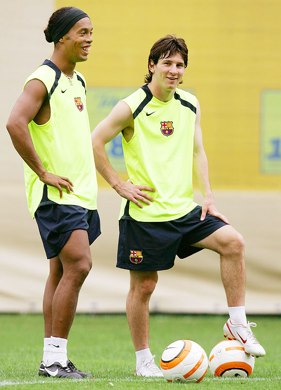 Ronaldinho and Lionel Messi at FC Barcelona's training session in August 2005