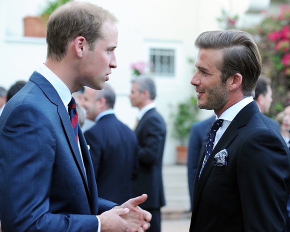 Prince William, Duke of Cambridge, speaks with David Beckham
