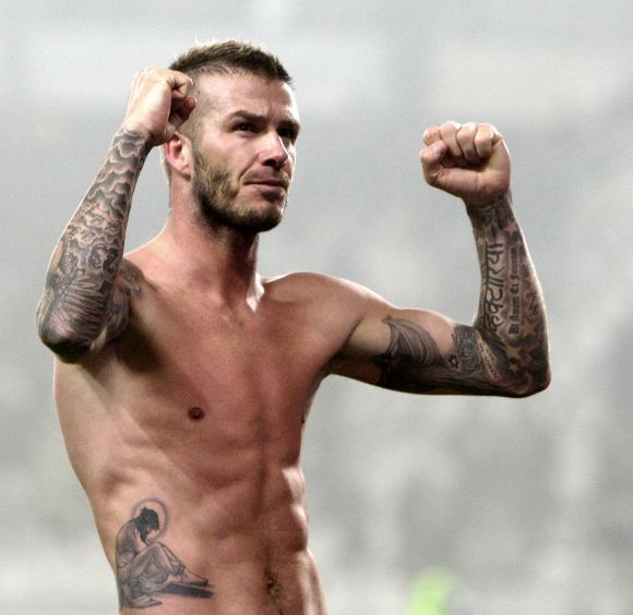 David Beckham's Tattoos and What They Mean [2024 Guide]