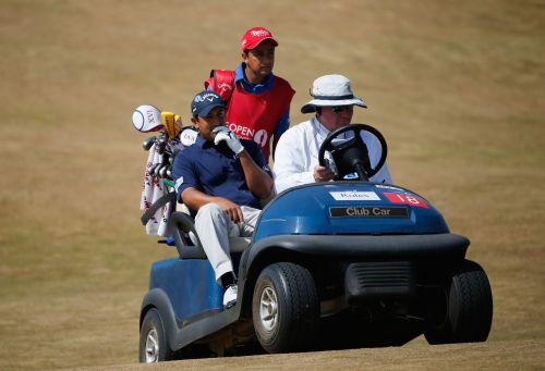 Shiv Kapur of India gets a ride back to the 6th green during the third round