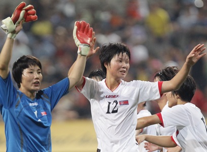 North Koreans get warm reception in South, win match