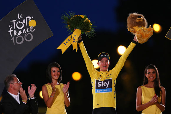 Winner of the 2013 Tour de France, Chris Froome of Great Britain and SKY Procycling celebrates on the podium