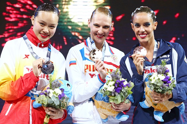 (From left) Silver medallist Huang Xuechen of China, gold medallist Svetlana Romashina of Russia and bronze medallist Carbonell Ballestero of Spain