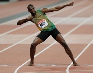 Usain Bolt celebrates after winning