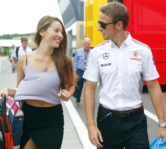 McLaren Formula One driver Jenson Button of Britain and his girlfriend, Japanese-Argentine model Jessica Michibata