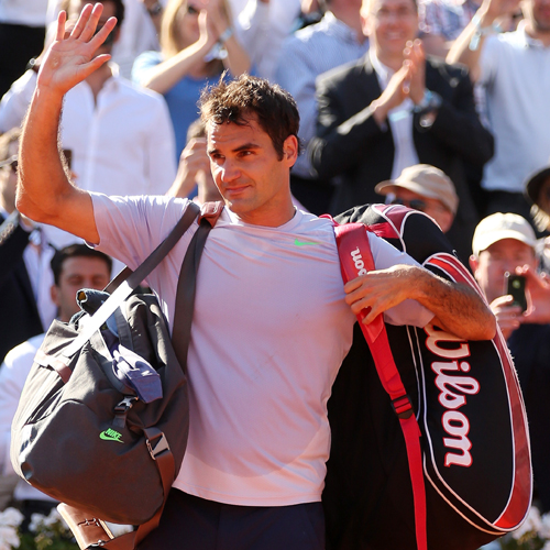 Roger Federer of Switzerland waves to the crowd after the defeat