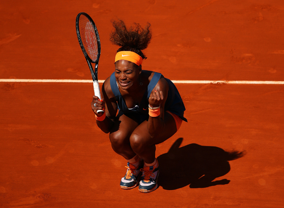 Serena Williams of United States of America celebrates match point during her quarter-final against Svetlana Kuznetsova of Russia