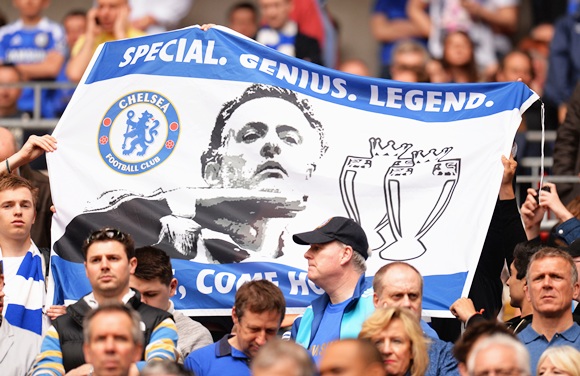 Chelsea fans hold up a banner