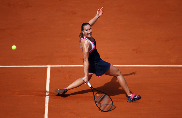 Jelena Jankovic of Serbia plays a backhand during her match against Maria Sharapova of Russia
