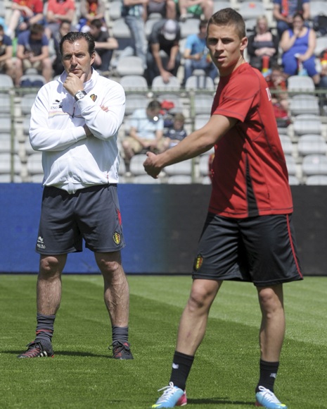 Belgium's coach Marc Wilmots (left) looks on next to   Thorgan Hazard during a training session