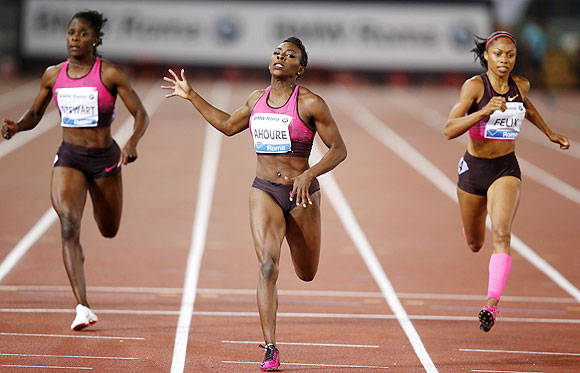 Murielle Ahoure of Ivory Coast (centre) crosses the finish line to win the women's 200m event during the Golden Gala IAAF Diamond League at the Olympic stadium in Rome on Thursday