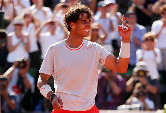 Rafael Nadal of Spain celebrates match point in the semi-final match against Novak Djokovic of Serbia