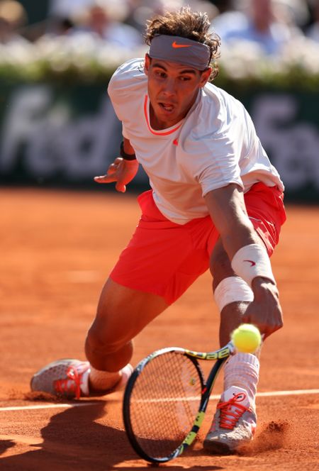 Rafael Nadal of Spain plays a backhand during the men's singles semi-final match against Novak Djokovic of Serbia