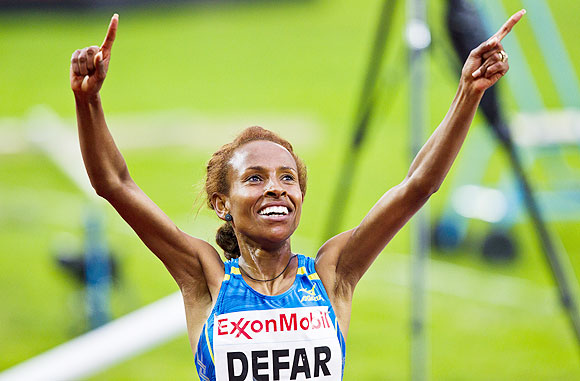 Meseret Defar of Ethiopia celebrates after winning the women's 5000m during the IAAF Diamond League athletics competition at the Bislett Stadium in Oslo on Thursday
