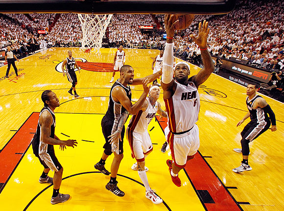 LeBron James of the Miami Heat goes up for a shot against the San Antonio Spurs