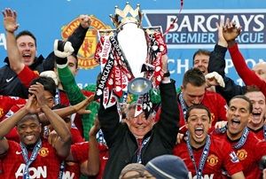 Image: Sir Alex Ferguson lifts the trophy with his Manchester United players after their concluding match against Swansea City last season.  Photograph: Phil Noble/Reuters