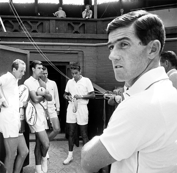 Professional tennis stars line up for a practice session at Wimbledon in 1967. Ken Rosewall stands on the right