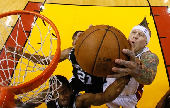 Chris Andersen (11) of the Miami Heat goes up for the ball   against Kawhi Leonard (2) of the San Antonio Spurs