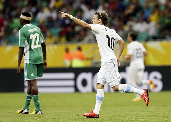 Uruguay's Diego Forlan celebrates after scoring against Nigeria during their Confederations Cup Group B match at the Arena Fonte Nova in Salvador on Thursday