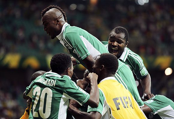 Nigeria's players celebrate after John Obi Mikel scored the equaliser against Uruguay during their Confederations Cup Group B match at the Arena Fonte Nova in Salvador on Thursday