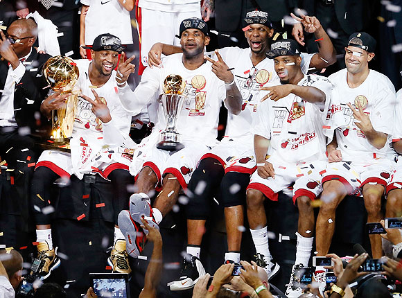 LeBron James (centre) celebrates with Miami Heat teammates after defeating the San Antonio Spurs 95-88 to win Game Seven of the 2013 NBA Finals at AmericanAirlines Arena on Thursday