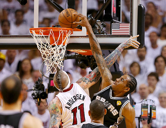 Kawhi Leonard #2 of the San Antonio Spurs goes up for a dunk over Chris Andersen #11 of the Miami Heat in the second quarter during Game Seven of the 2013 NBA Finals on Thursday