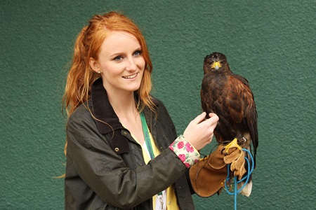 Imogen Davis (L) poses with Rufus the Hawk