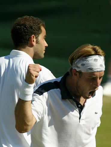 George Bastl of Switzerland celebrates after his victory over Pete Sampras of the USA in 2002